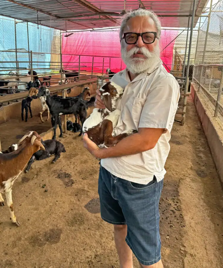 Kanwaljeet Singh, founder of ClubCampers at the goat shed in Dee Mandal farms